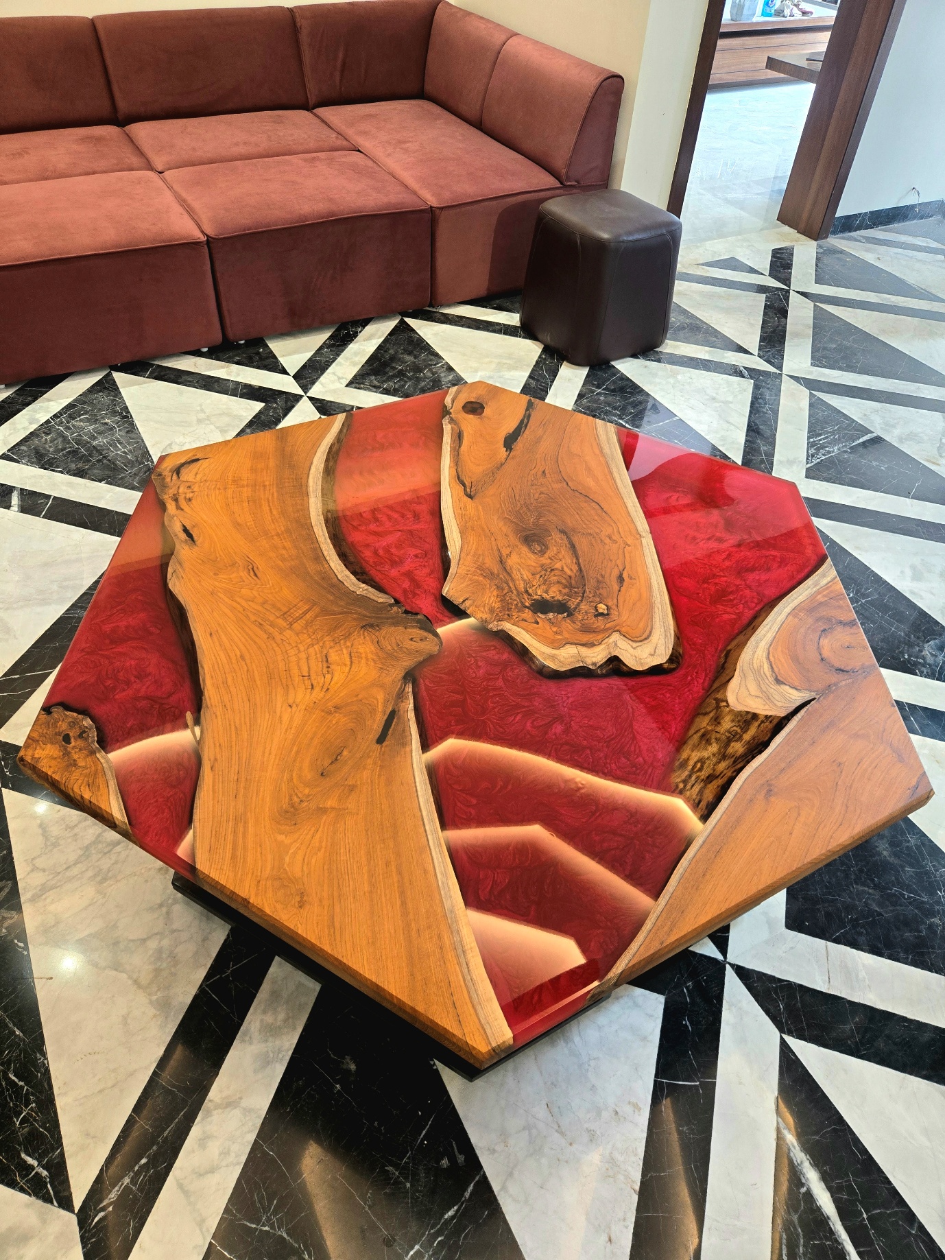 Hexagonal river table with warm wood and red resin