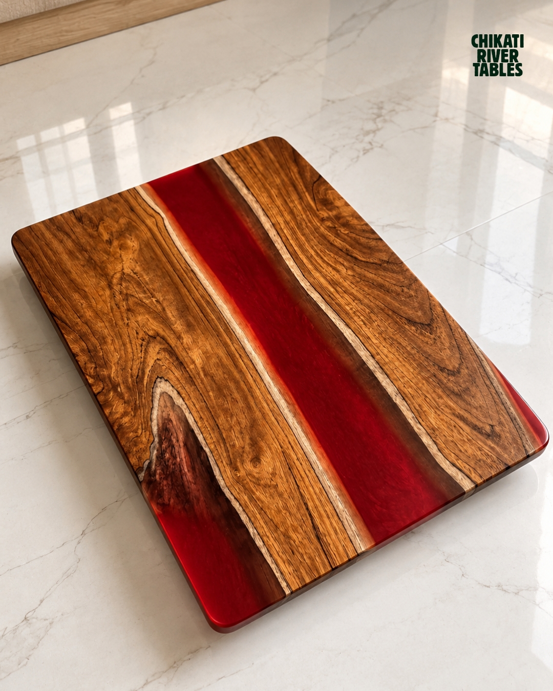 Small rectangular teak table with a deep red resin river
