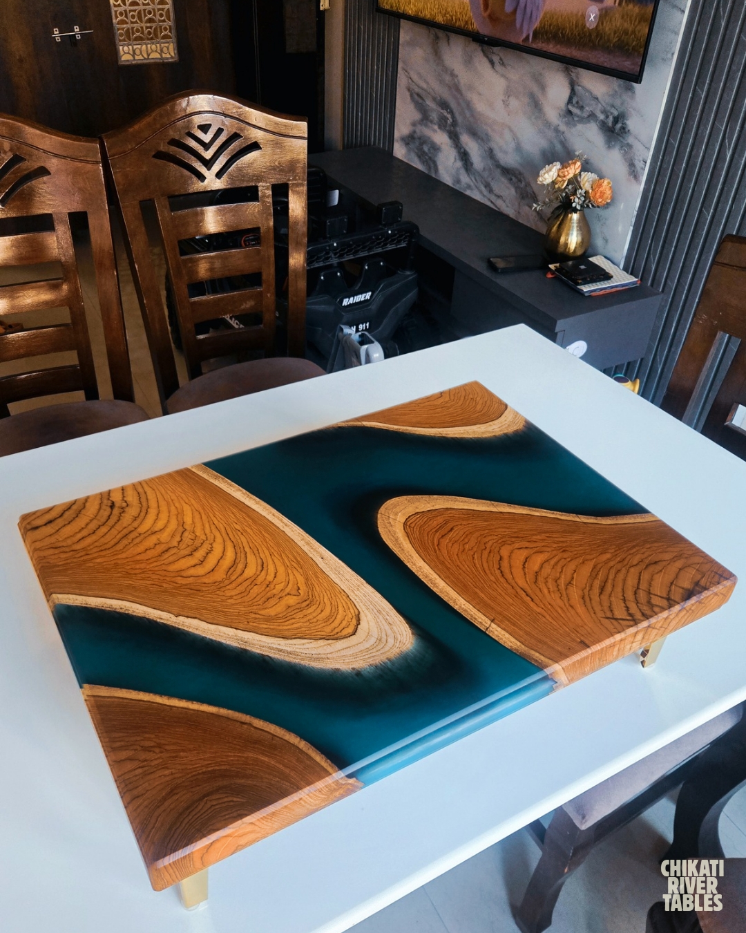 Small rectangular teak table with a winding turquoise resin river